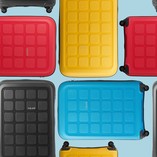 tripp suitcases in red blue yellow and black
