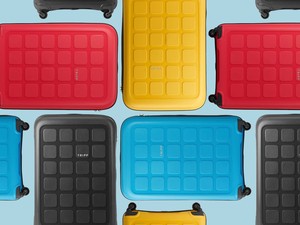 tripp suitcases in red blue yellow and black