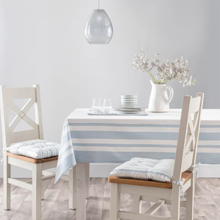 Riviera Stripe Tablecloth with white chairs