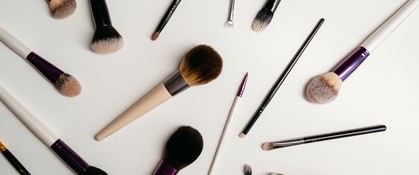 makeup-brushes-scattered-on-surface