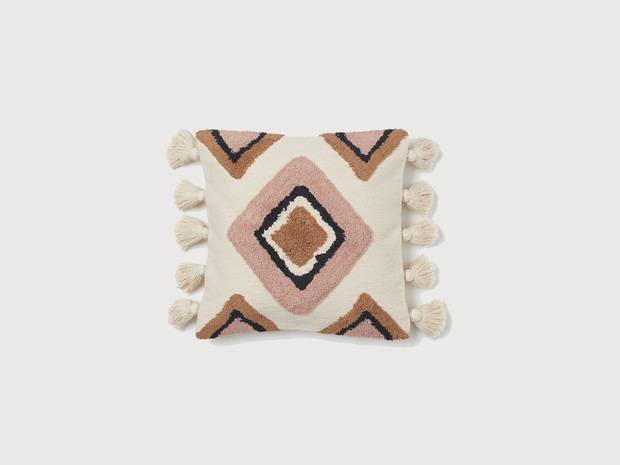 H&M Cushion cover with tassels can be used to promote hygge.