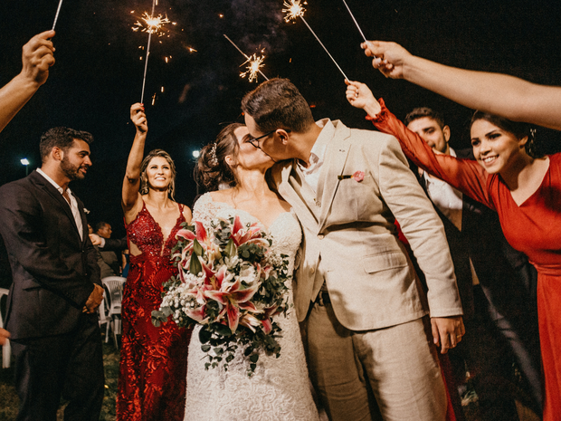 how-to-choose-a-wedding-venue-couple-with-sparklers_1.png